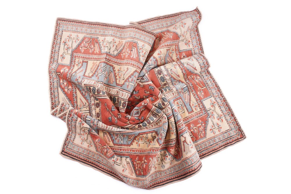 Machine-woven synthetic rug